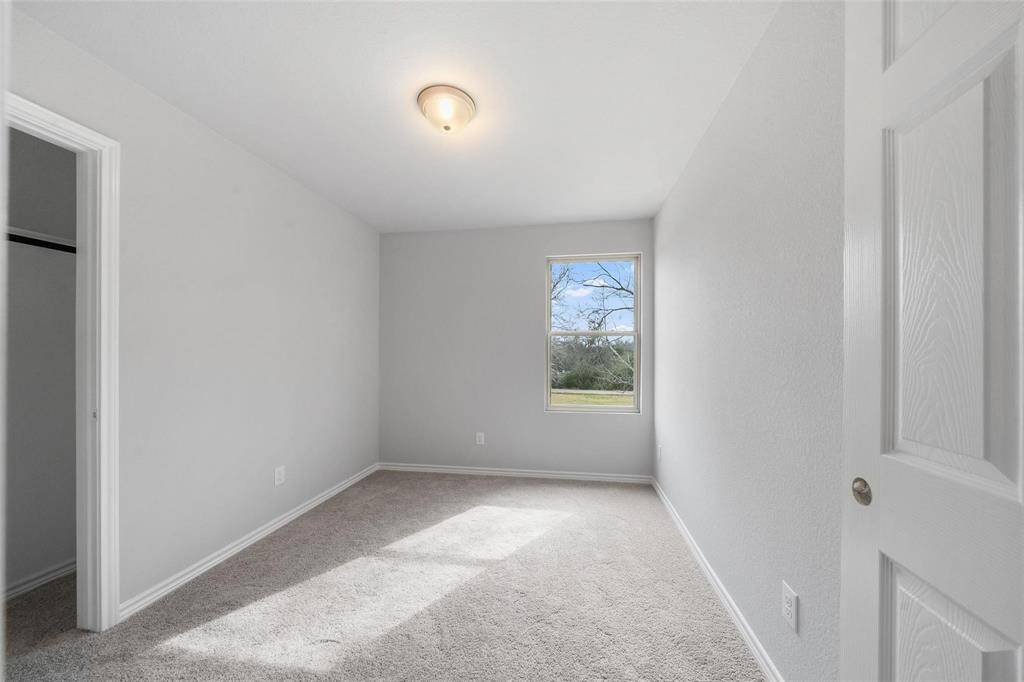 The third bedroom features a spacious closet.