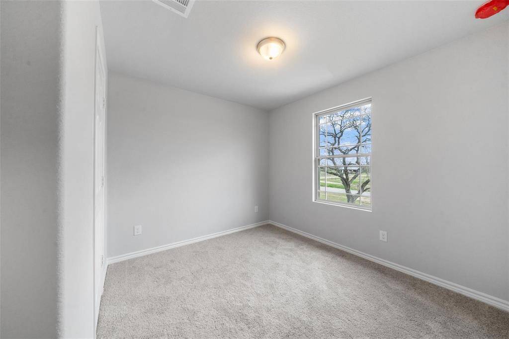 Spacious and bright, the fourth bedroom includes its own oversized accented window.