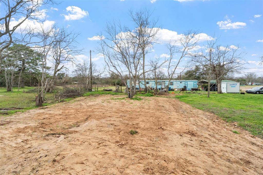 The generously sized backyard is perfect for pets or children to run and play.
