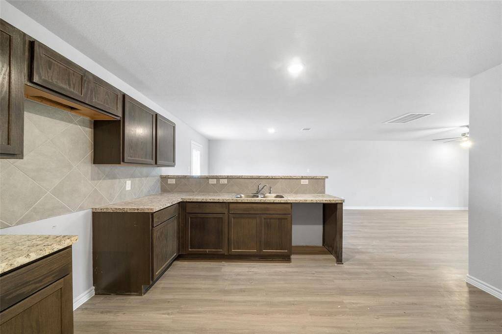 Convenient bar-height counter behind the sink—perfect for serving or casual dining.