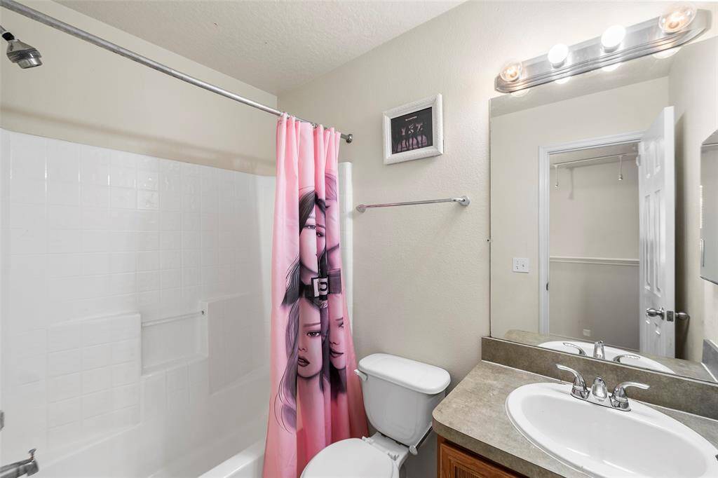 Full bathroom between bedrooms 2 and 3 on the second floor.