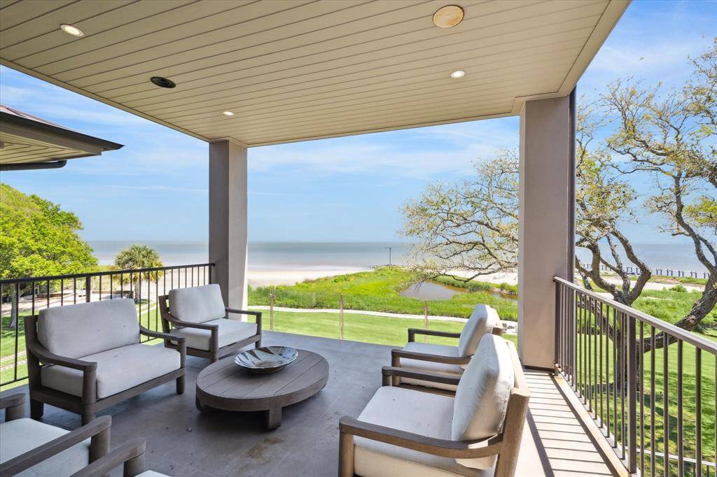 Take in the beauty of the bay as you watch the boats go by on your spacious terrace - one of many outdoor areas this home offers.