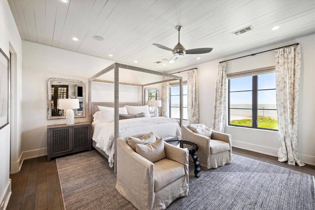 Retreat to the primary suite and experience true luxury. Notice the bay view!
