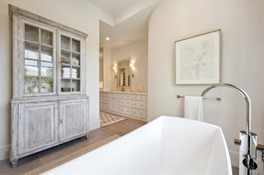 The primary en suite bathroom has an impressive closet - large enough for a chaise lounge - and its own washer and dryer, exclusive to the primary suite.