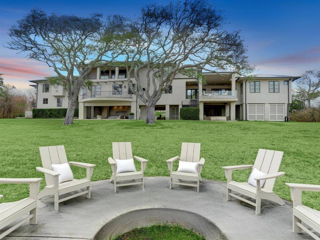 A relaxing in-ground fire pit by the marshy pond offers another opportunity to take in the natural oasis.