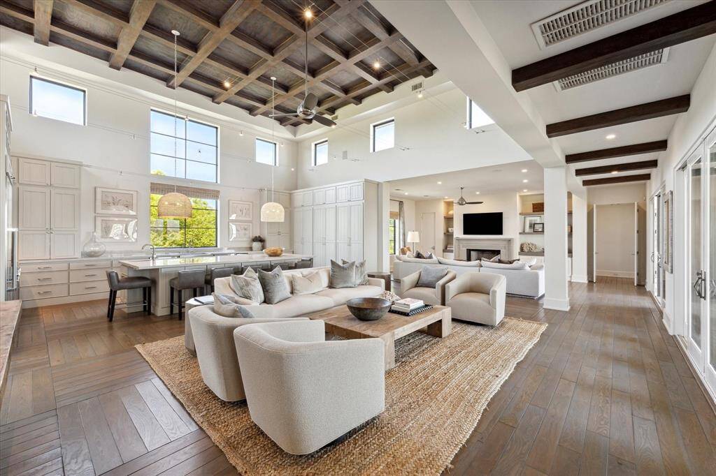Elegant and inviting, this home showcases soaring coffered ceilings and abundant natural lighting with unmatched views from every window!