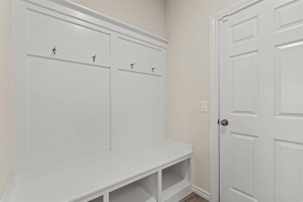 Mud room adjacent to utility room off garage