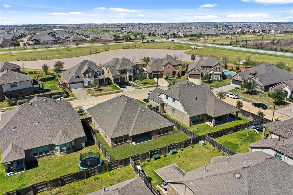 Aerial view of exterior with lakeview