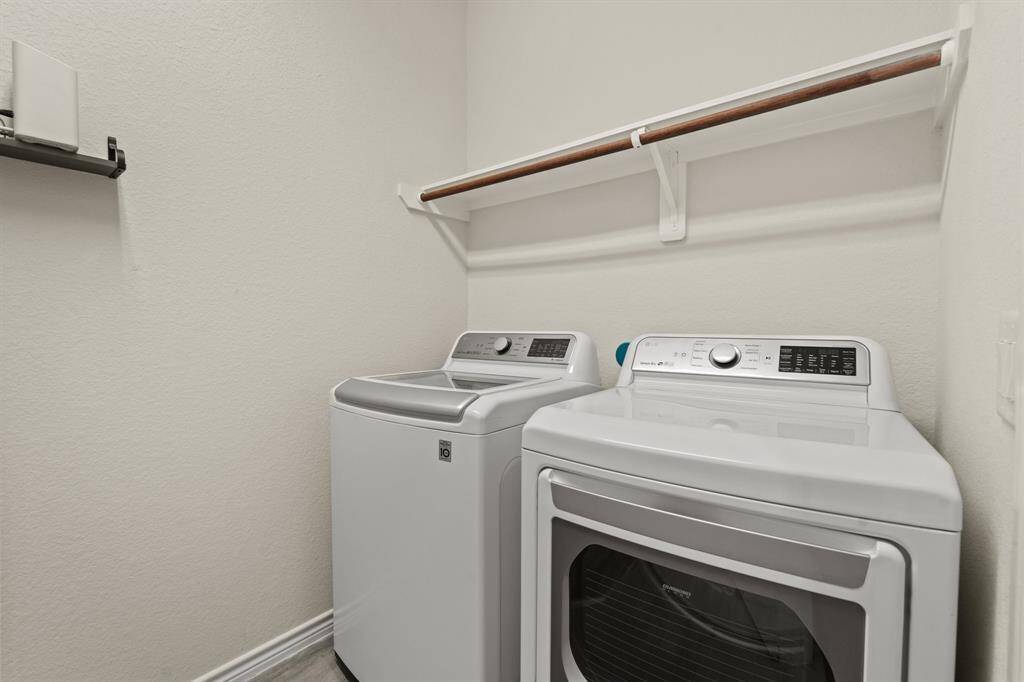 Utility room adjacent to mud area and garage.