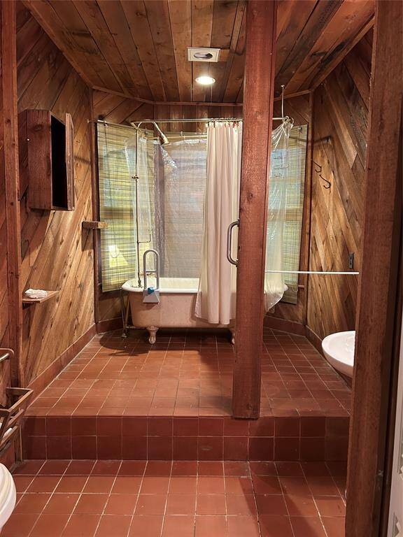 Cedar bathroom with antique clawfoot tub