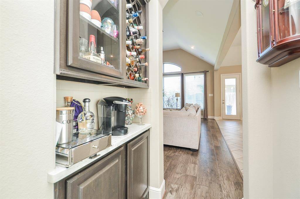 A butler's pantry can never have enough accolades! Yours in conveniently off the living area.