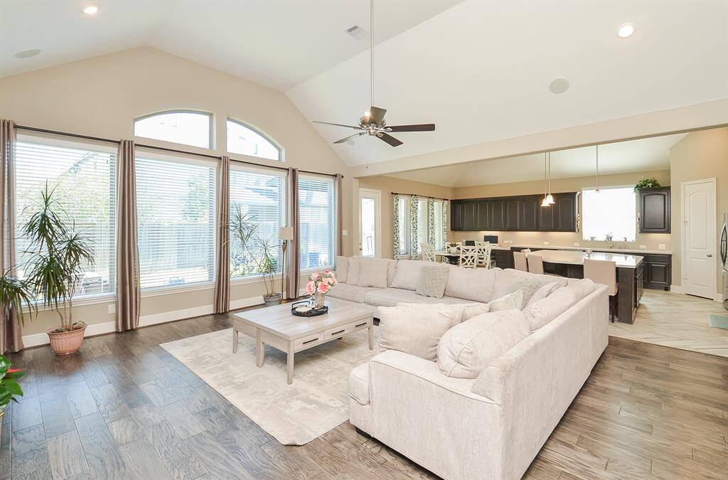 The heavenly high ceiling embraces tons of combined living/kitchen space, with walls of windows for bright, natural light during the day, and dark romantic skies, at night.