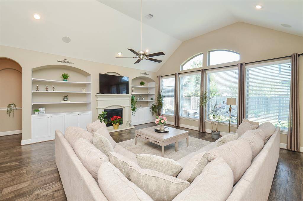 The built-in fireplace is sure to be the star of the show this holiday season! And, don't you absolutely love the custom, built-in shelving?!