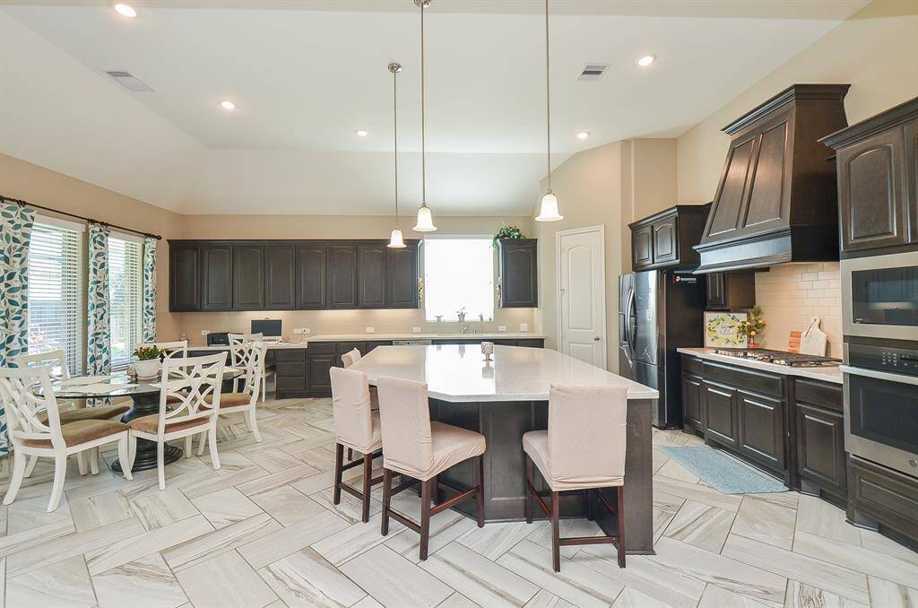At right is the perfect spot for a cozy breakfast/casual dining nook --- which will, most likely, become family central in no time!