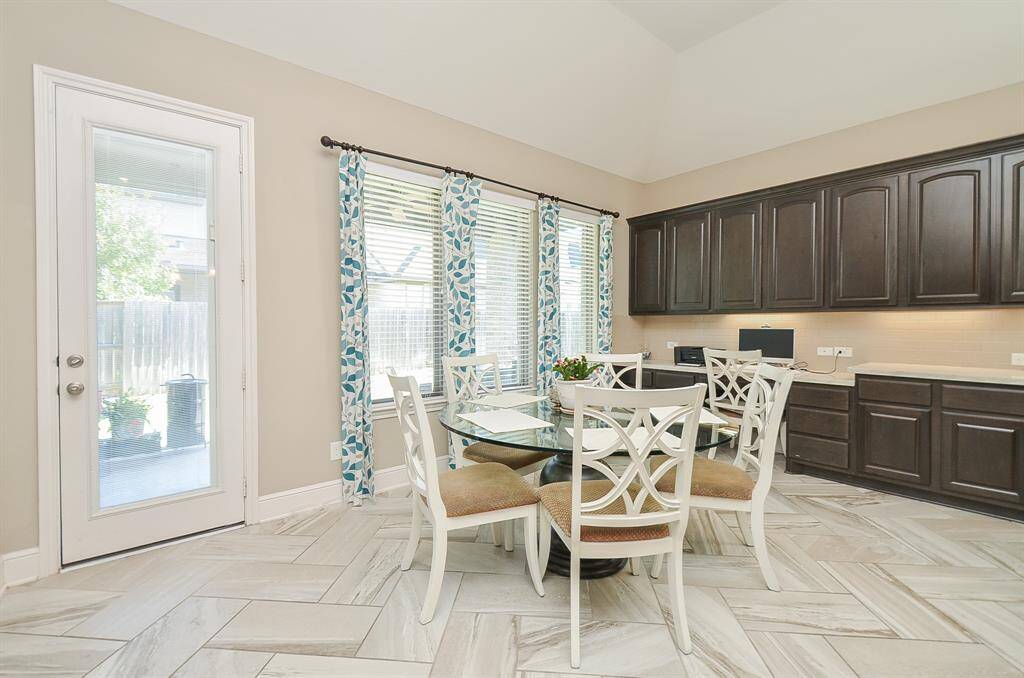 The lovely patio serves as a welcomed outdoor mural for dinners in the breakfast nook.