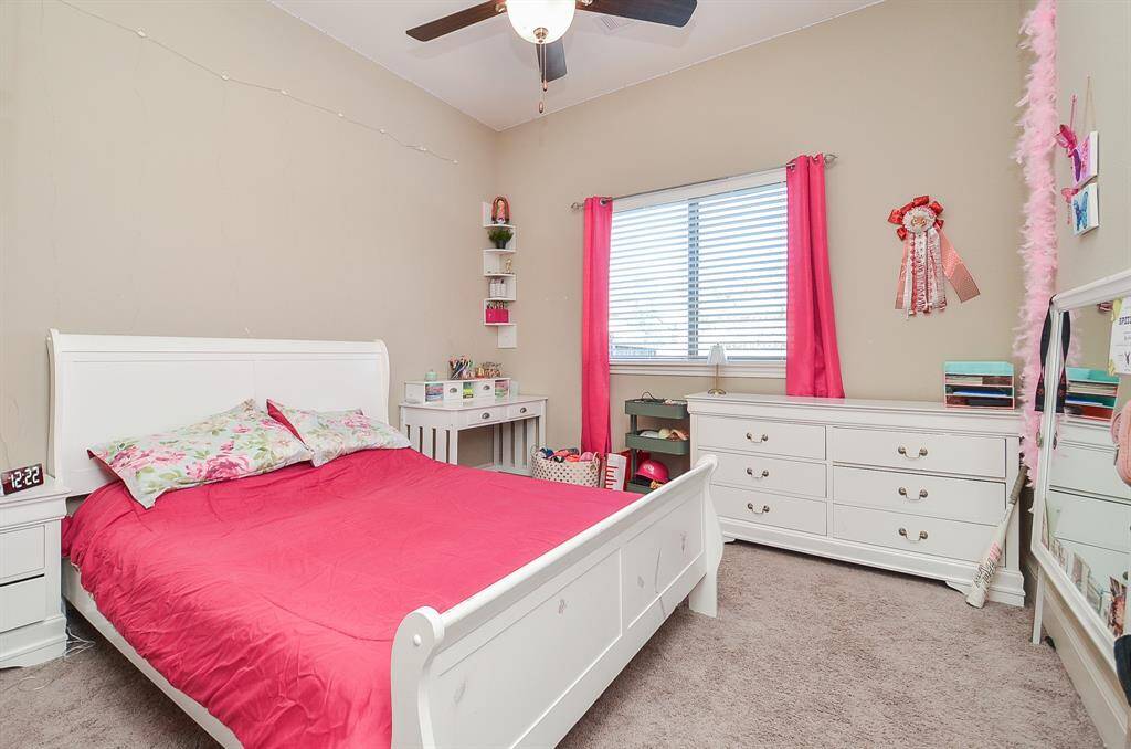 Another generous secondary bedroom is suited for large pieces.