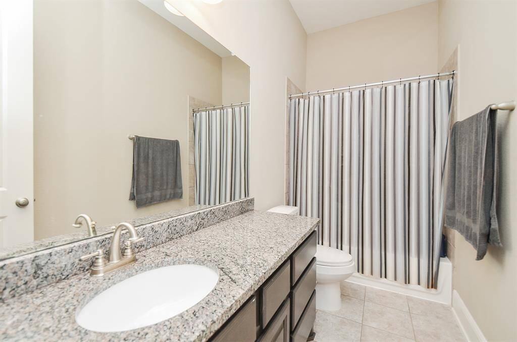 A second bath features combined shower/bathtub for easy personal options.