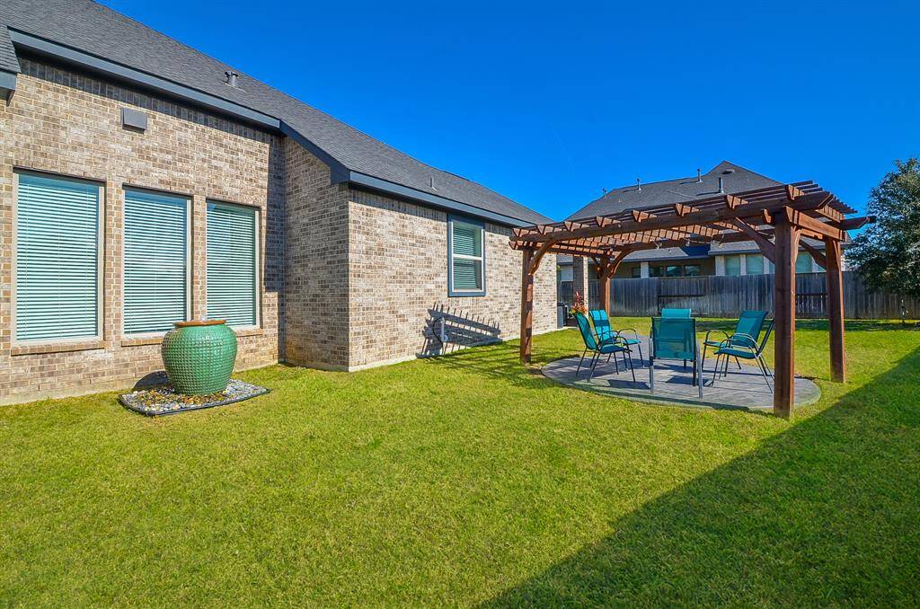 Want some precious privacy? Here's that spot under the appealing pergola.