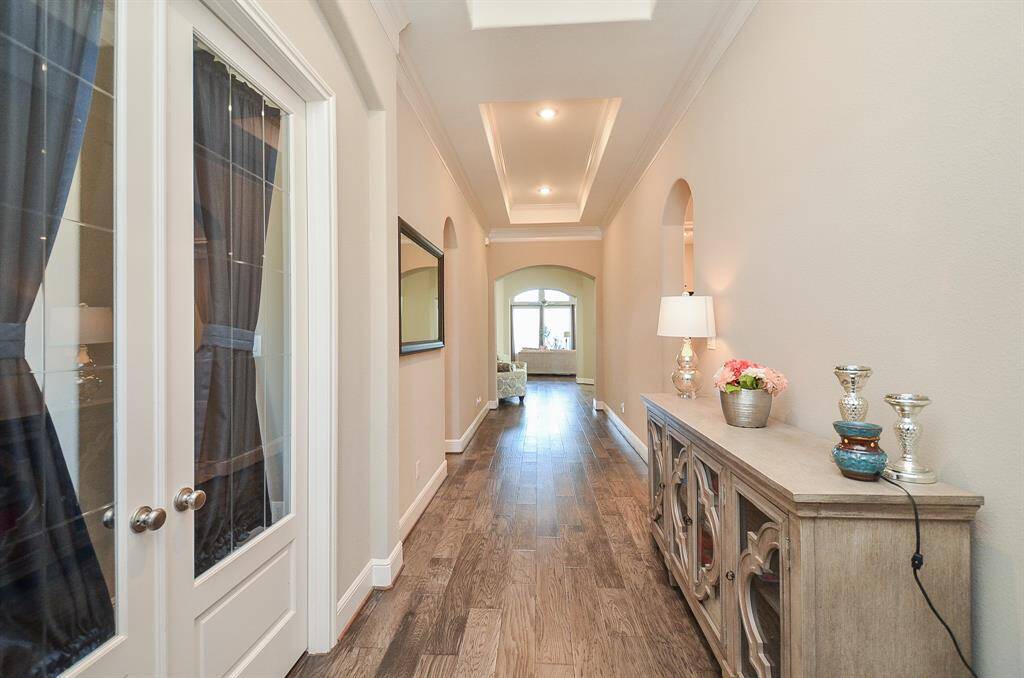 This is the long, wide open, airy view from the front entry straight back to the huge living area.