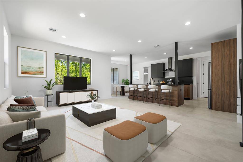 Bright, open living space virtually staged to showcase its seamless flow from lounging to entertaining.