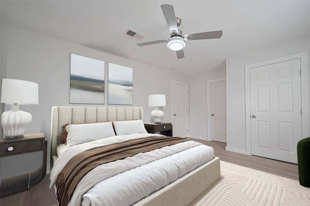 *virtually staged* The primary bedroom is spacious and serene, featuring oversized windows and a ceiling fan, ensuring plenty of light and airflow throughout.