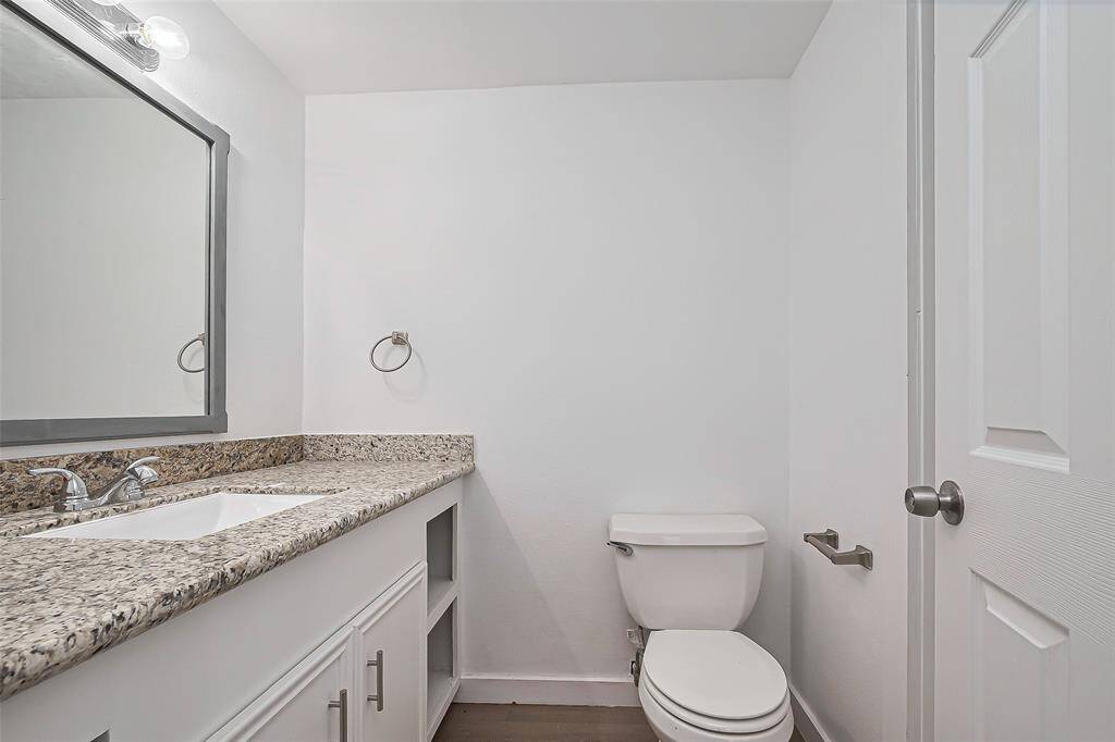 This half bath is cleverly designed, making the most of its space without sacrificing functionality or comfort.
