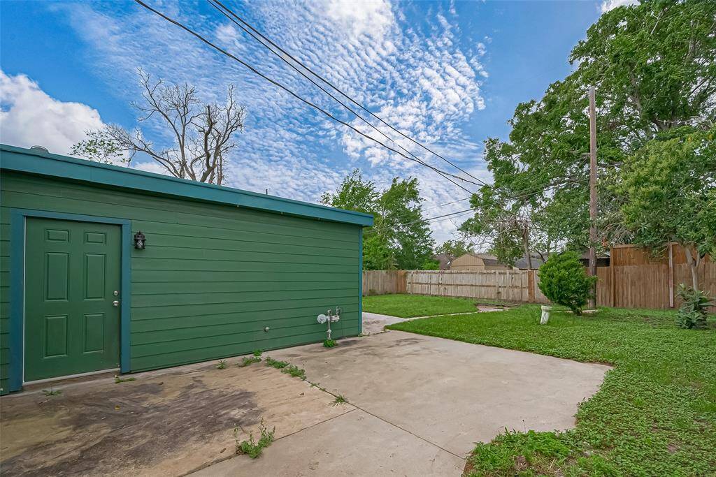The backyard offers plenty of space for outdoor enjoyment, featuring an oversized uncovered patio perfect for alfresco dining, relaxation, or entertainment.