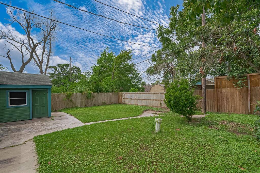 Expansive green lawns fill the backyard, offering a peaceful retreat and plenty of room for various outdoor activities and landscaping options.