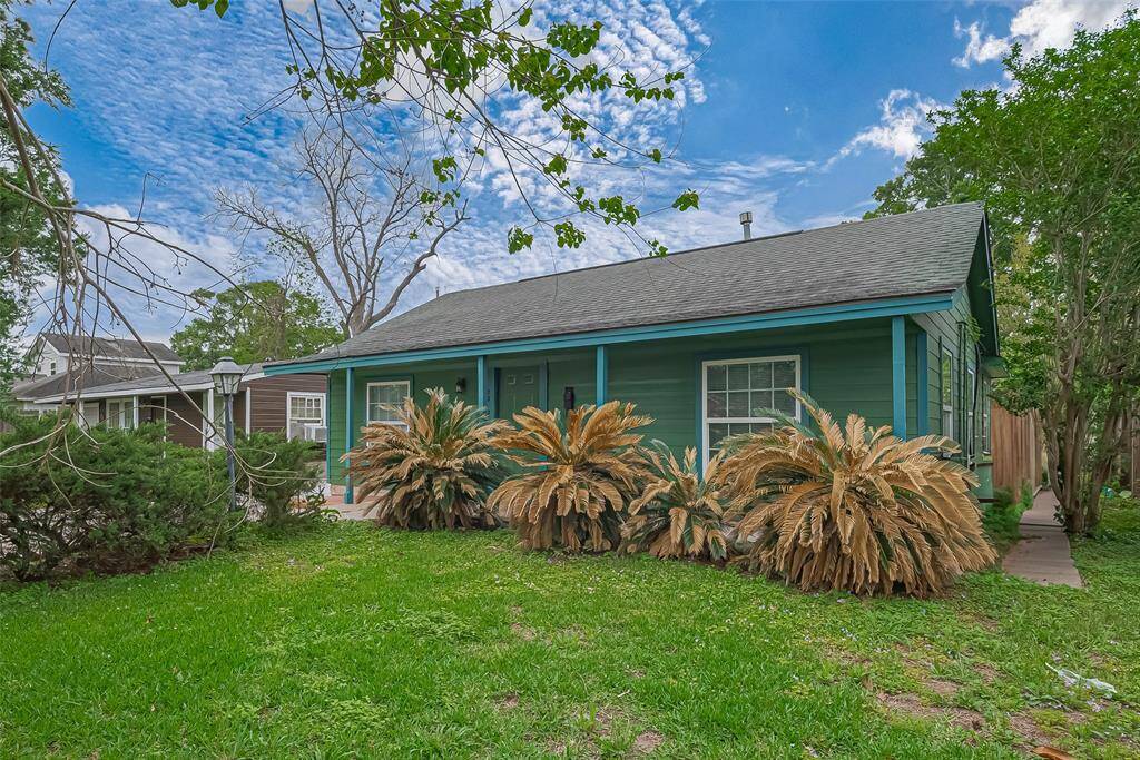 The front of the home is beautifully framed by plants and greenery, creating an inviting atmosphere while maintaining privacy and curb appeal.
