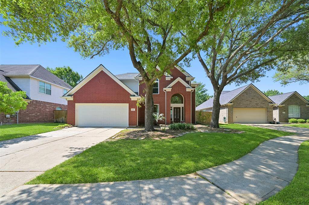 ENJOY CURB APPEAL, LARGE DRIVEWAY, AND EASY ACCESS TO PARKS, SCHOOLS, AND SHOPPING.