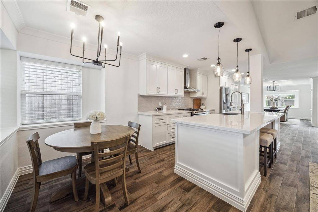 Great breakfast nook right off the kitchen. The large island has additional counter seating.