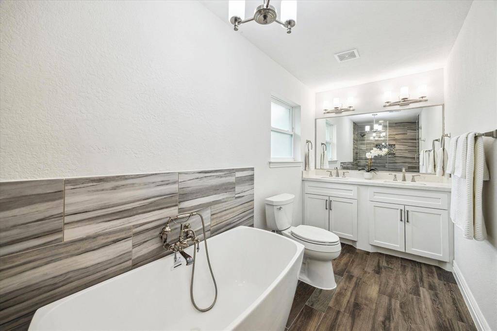 Beautiful primary bath has been completely remodeled with elegant finishes.