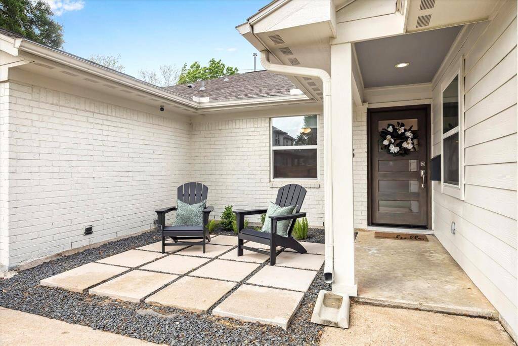 The inviting entry is the perfect spot to relax or visit with neighbors. Use this courtyard for seating or create a cozy garden.