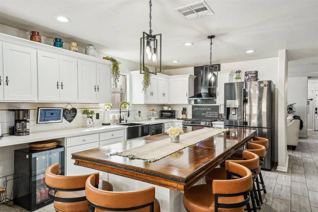 Angle 2 of the kitchen, featuring the custom island, as well as new cabinet faces.