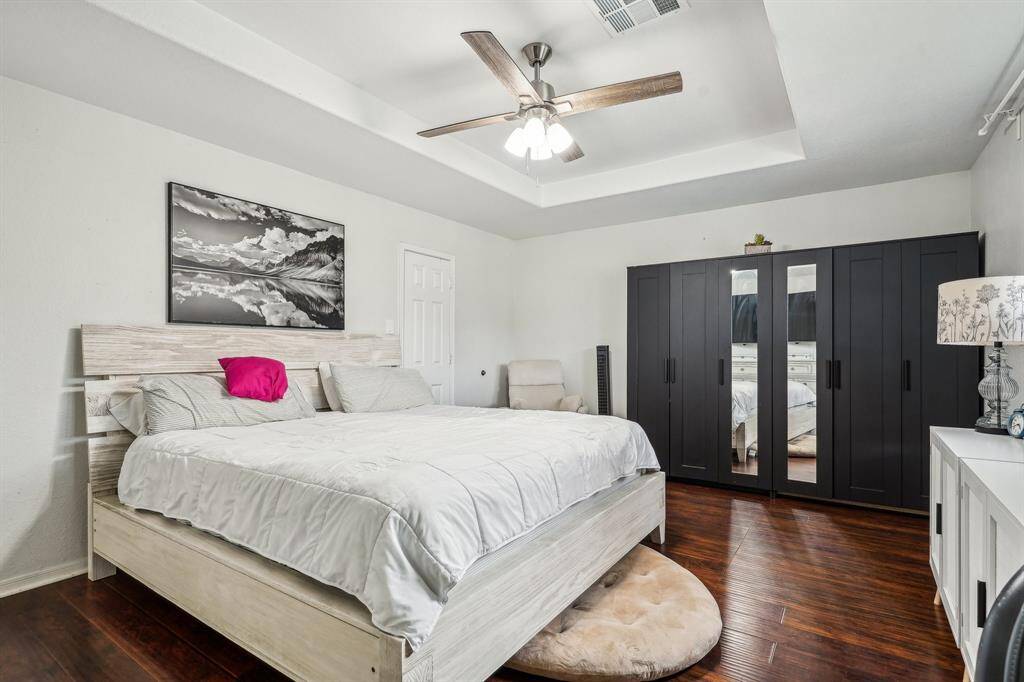 Passing the family room, you will enter into the primary bedroom, in the rear of the home.