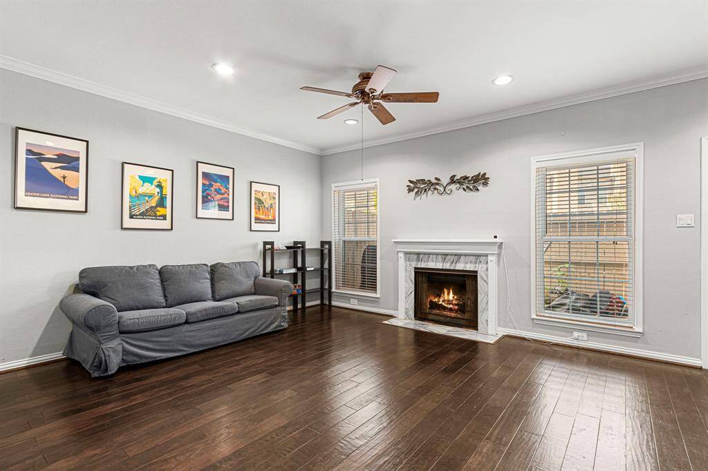 Cozy up by the wood-burning fireplace, framed by large double-pane windows with views of your private, enclosed patio.