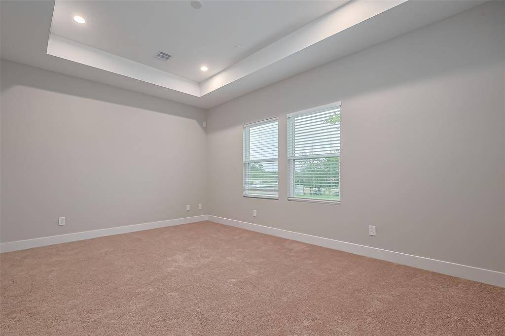 Huge primary bedroom with lots of natural lighting!