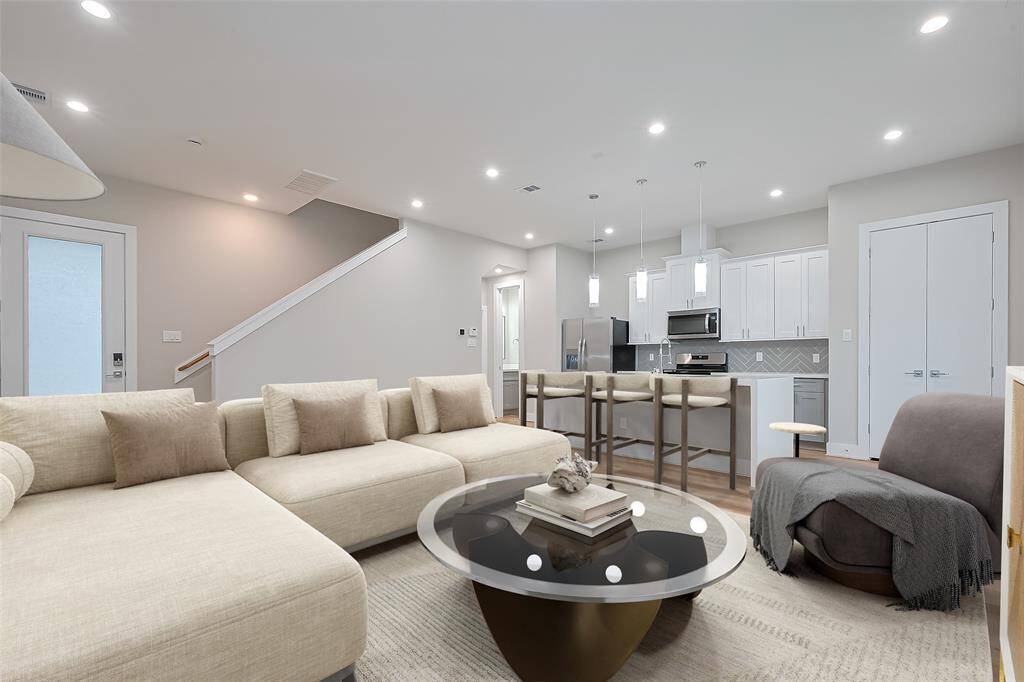 living room and kitchen area virtually staged