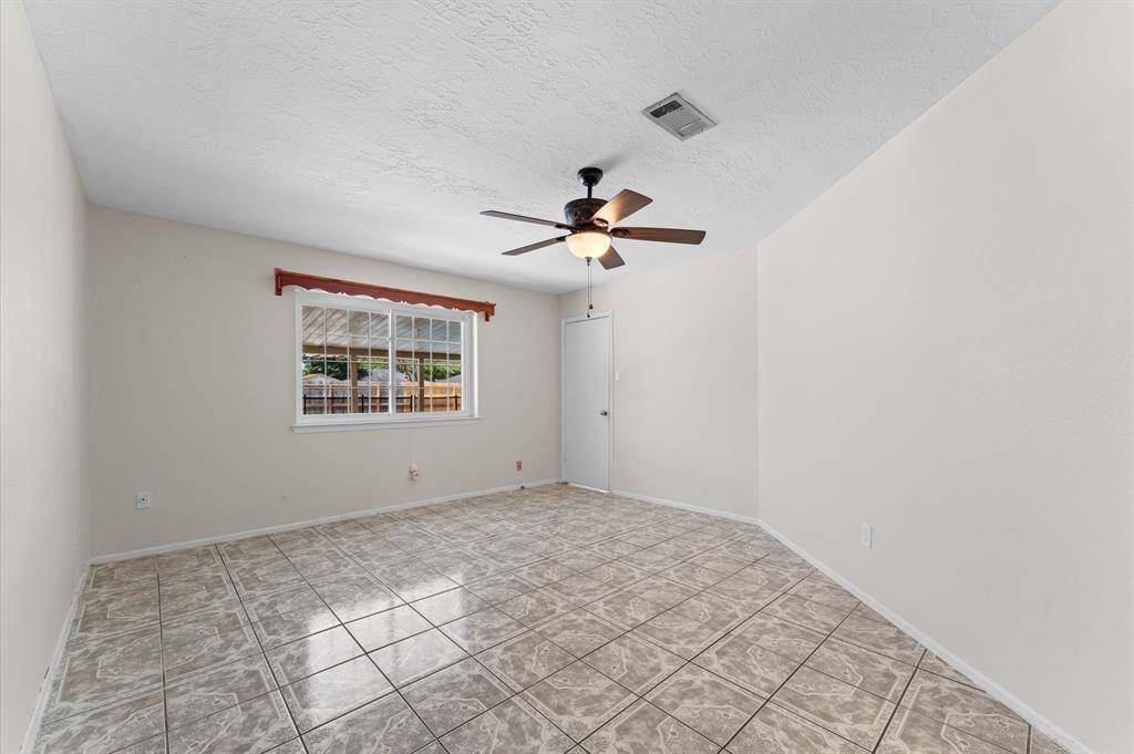 Primary Bedroom with view of pool