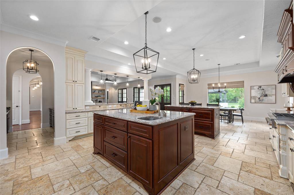 View of how the kitchen flows seamlessly with the formal dining room, butlers pantry, breakfast area and open to the Living Room!