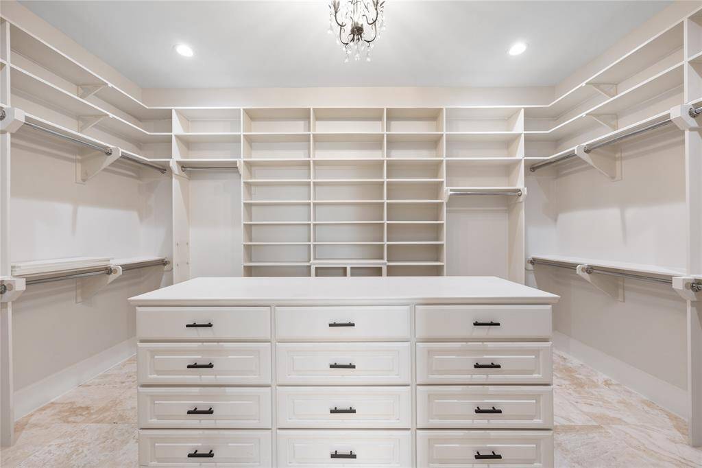 Walk in closet won't disappoint! So much storage and customizable shelves
