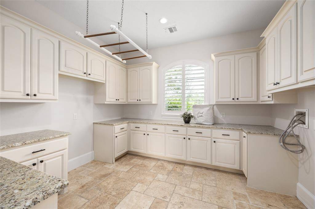 Laundry room is so big, you'll almost enjoy doing laundry!