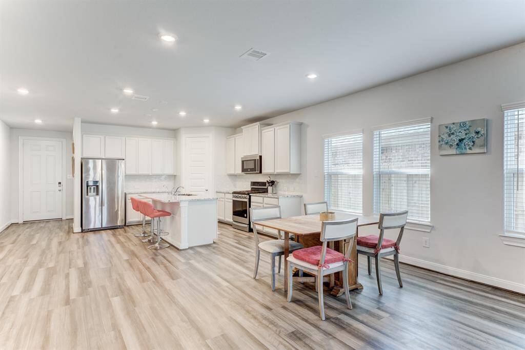 A view from the family room looking into the kitchen.