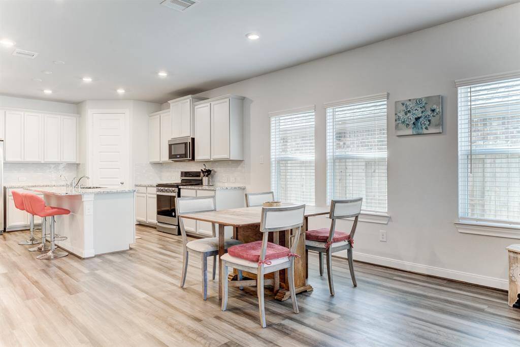 Windows provide natural light into the dining area.