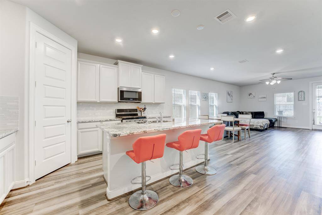Open Floor plan offers a kitchen open to the family room.  Breakfast bar off the island and a corner walk in closet.