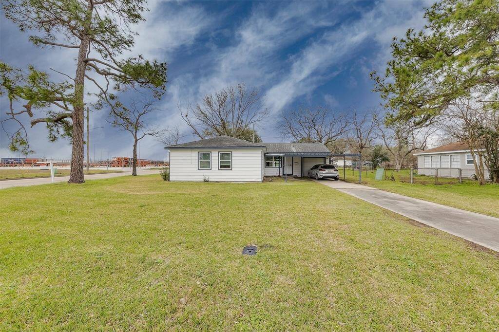 EXTRA LONG DRIVEWAY! That leads to the attached CAR GARAGE!!! & CARPORT! In the back, you'll see the storage! Extra garage, carport and back covered porch! This house offers so much!