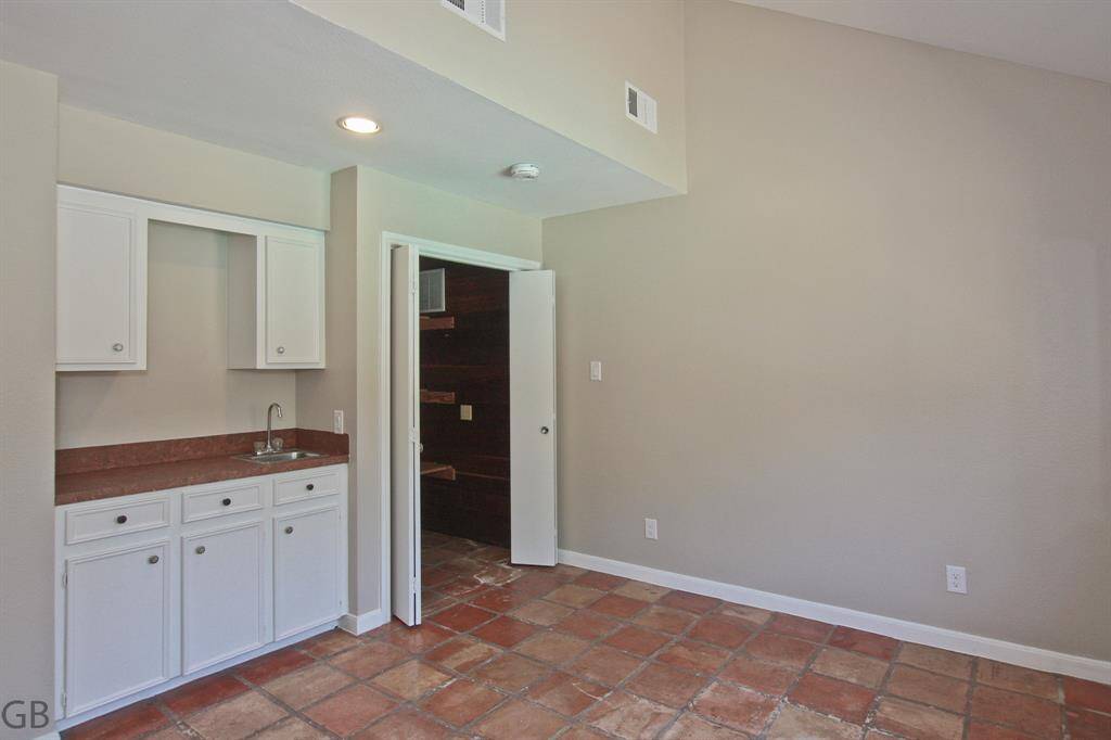 Bed 5, quarters? Flex room?  Cedar Closet, sink, view to pool area.