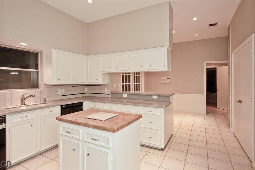 Main Living room. 10 foot ceilings, views both front and back. Access to rear pool area.