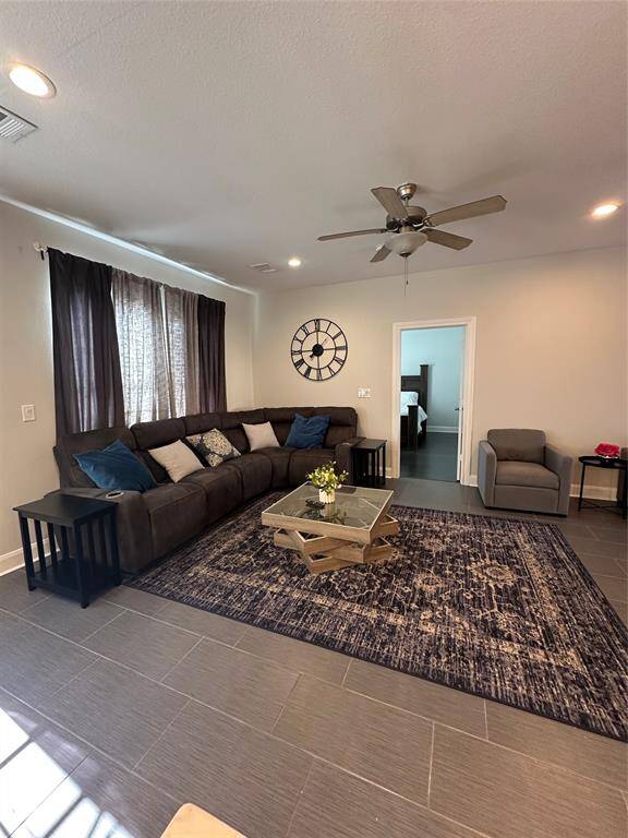 ANOTHER VIEW OF THE LIVING AREA