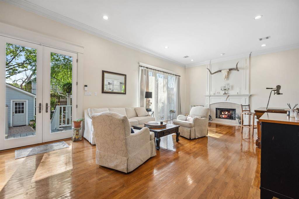 The family room features French doors that open to the backyard, enhancing the flow between indoor and outdoor living.